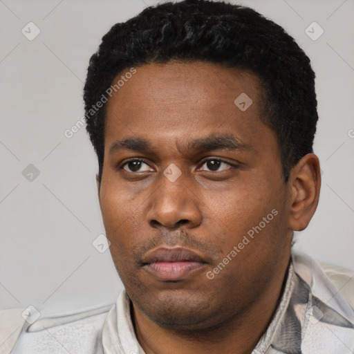Neutral black young-adult male with short  black hair and brown eyes