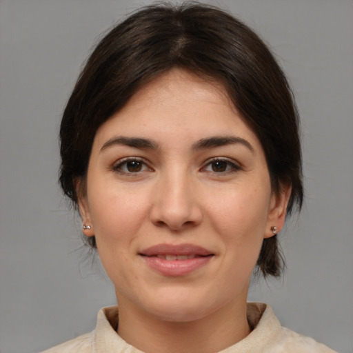 Joyful white young-adult female with medium  brown hair and brown eyes