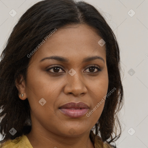 Joyful black young-adult female with long  brown hair and brown eyes