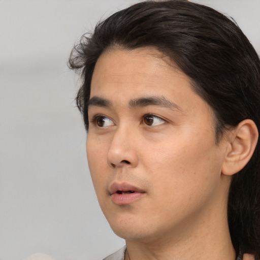 Neutral white young-adult male with medium  black hair and brown eyes