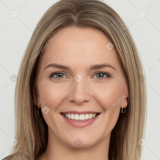 Joyful white young-adult female with long  brown hair and green eyes