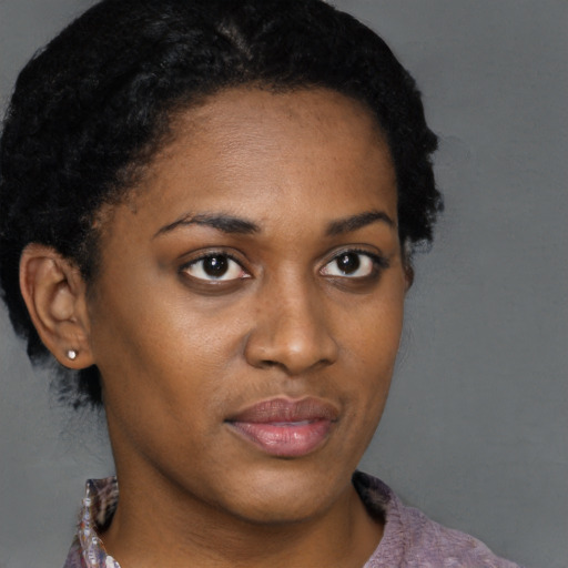 Neutral black young-adult female with short  brown hair and brown eyes