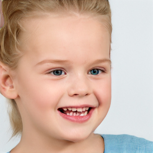 Joyful white child female with short  brown hair and blue eyes