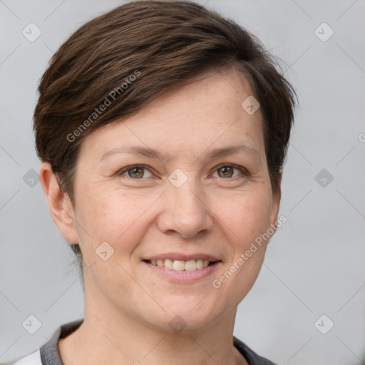 Joyful white adult female with short  brown hair and grey eyes