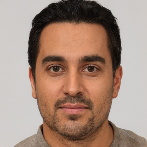 Neutral white young-adult male with short  black hair and brown eyes