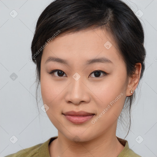 Joyful asian young-adult female with medium  brown hair and brown eyes