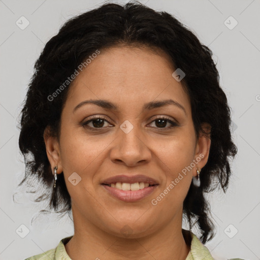 Joyful latino adult female with medium  brown hair and brown eyes