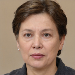 Joyful white adult female with short  brown hair and brown eyes