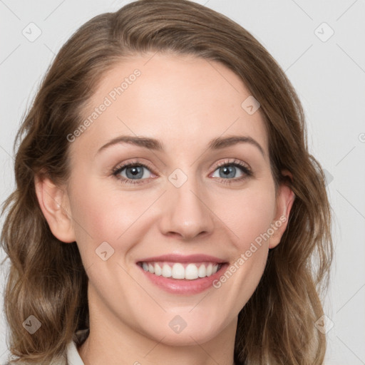 Joyful white young-adult female with medium  brown hair and green eyes