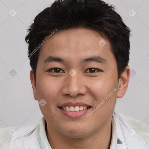 Joyful asian young-adult male with short  brown hair and brown eyes