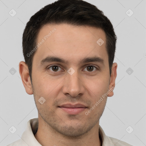 Joyful white young-adult male with short  brown hair and brown eyes