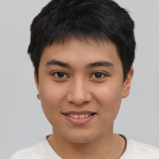 Joyful asian young-adult male with short  brown hair and brown eyes