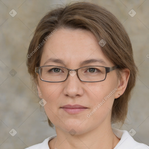 Joyful white adult female with medium  brown hair and grey eyes