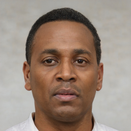 Neutral black adult male with short  brown hair and brown eyes