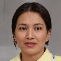 Joyful asian young-adult female with medium  brown hair and brown eyes