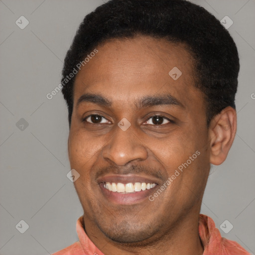 Joyful latino young-adult male with short  brown hair and brown eyes