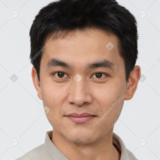 Joyful white young-adult male with short  black hair and brown eyes