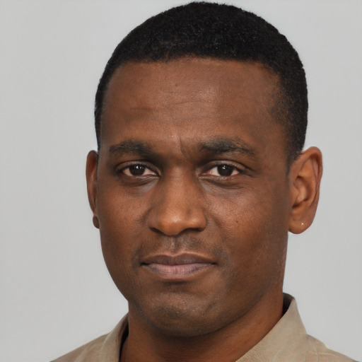 Neutral black young-adult male with short  black hair and brown eyes