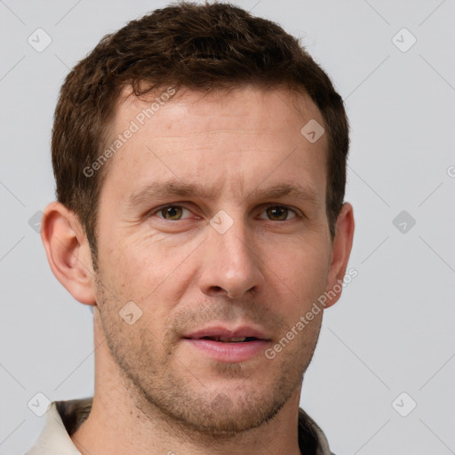 Joyful white adult male with short  brown hair and grey eyes