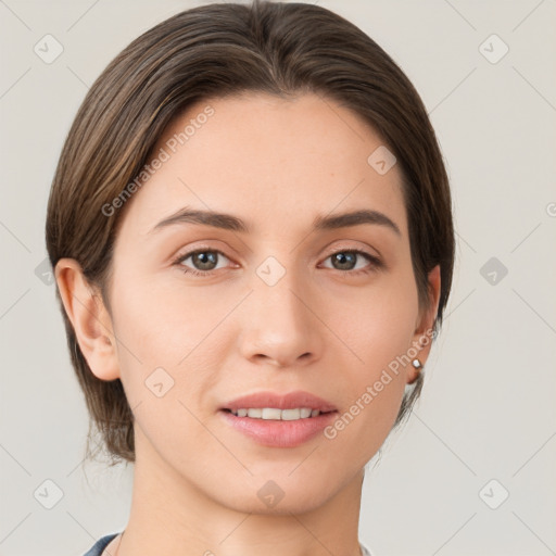 Joyful white young-adult female with short  brown hair and grey eyes