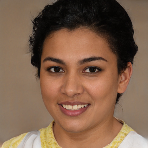 Joyful white young-adult female with short  brown hair and brown eyes
