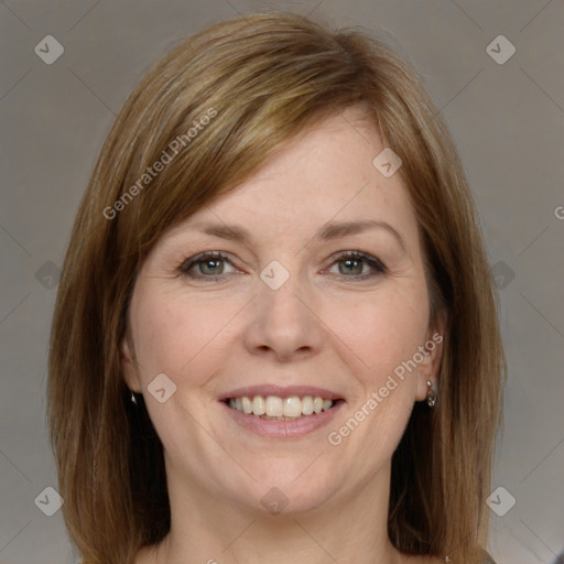 Joyful white adult female with medium  brown hair and grey eyes