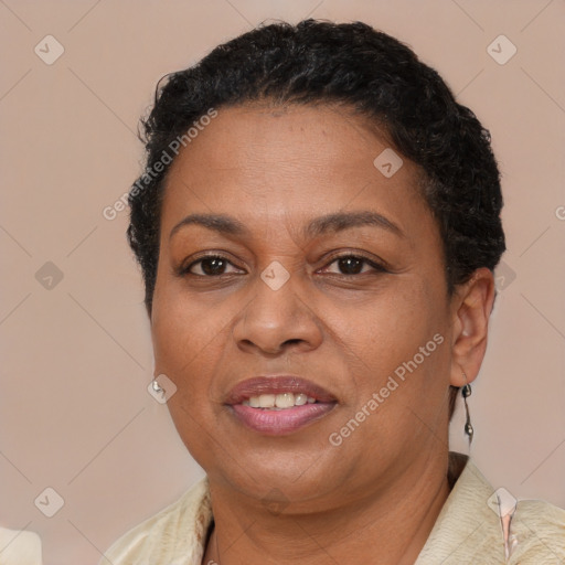 Joyful black adult female with short  brown hair and brown eyes