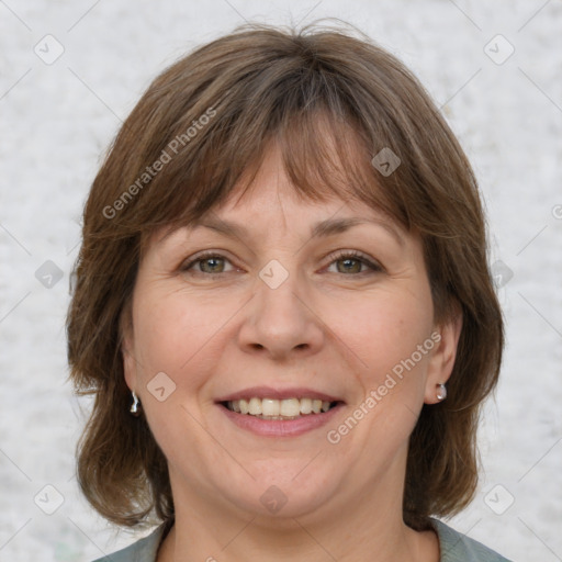 Joyful white adult female with medium  brown hair and grey eyes