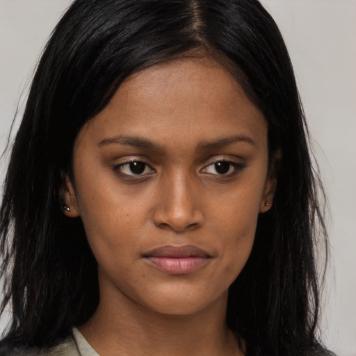 Joyful asian young-adult female with long  black hair and brown eyes