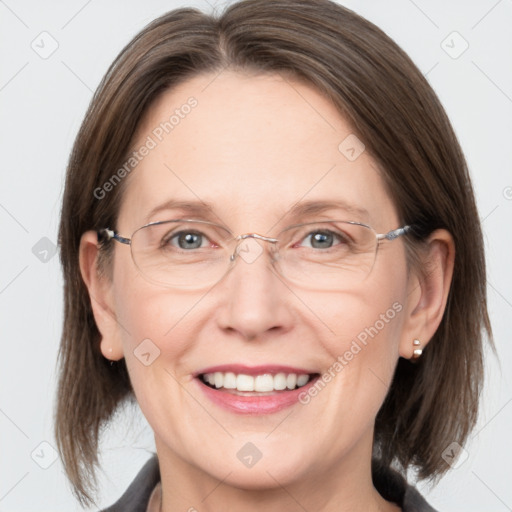 Joyful white adult female with medium  brown hair and grey eyes