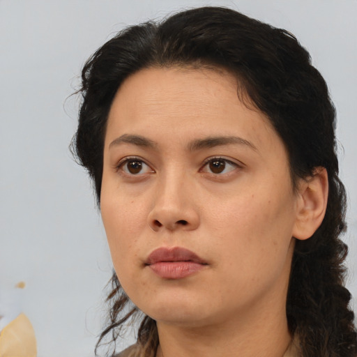 Neutral asian adult female with medium  brown hair and brown eyes