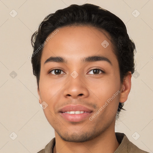 Joyful latino young-adult male with short  black hair and brown eyes