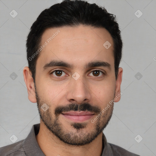 Joyful white young-adult male with short  black hair and brown eyes