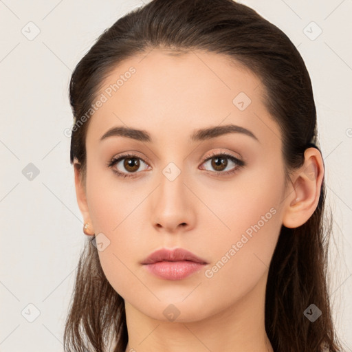 Neutral white young-adult female with long  brown hair and brown eyes