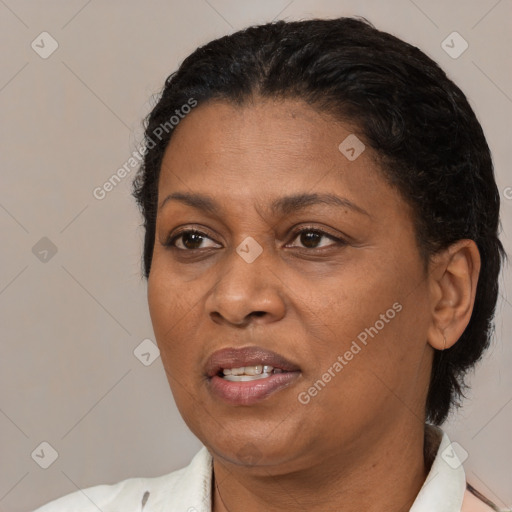 Joyful black adult female with short  brown hair and brown eyes