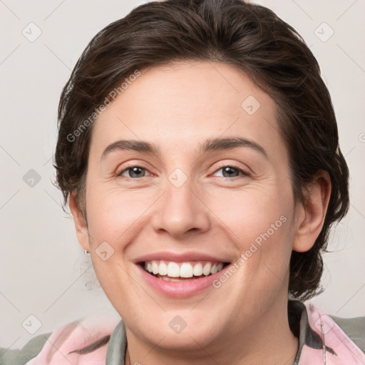 Joyful white young-adult female with medium  brown hair and grey eyes