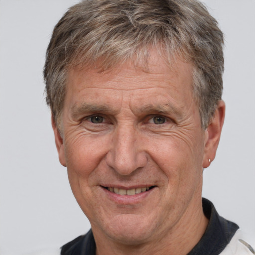 Joyful white middle-aged male with short  brown hair and brown eyes