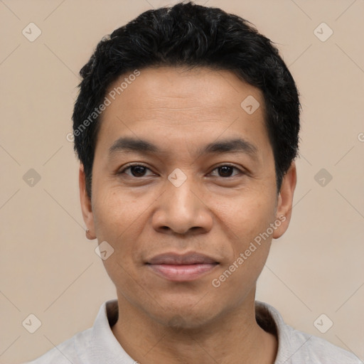 Joyful asian young-adult male with short  black hair and brown eyes