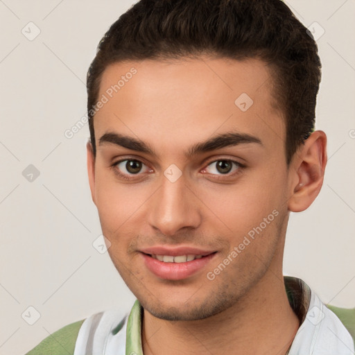 Joyful white young-adult male with short  brown hair and brown eyes