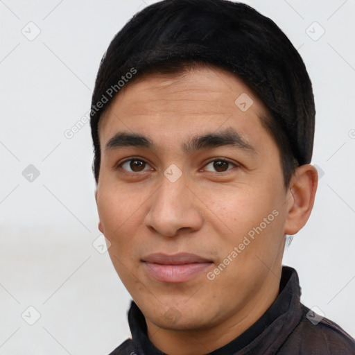 Joyful latino young-adult male with short  black hair and brown eyes