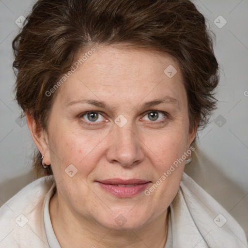 Joyful white adult female with medium  brown hair and blue eyes