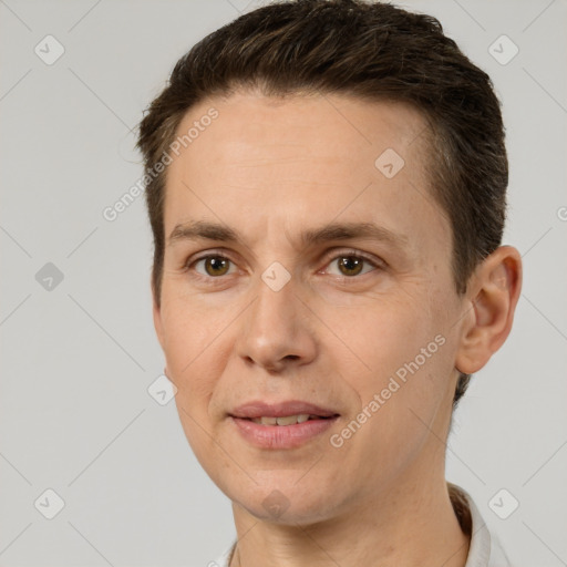 Joyful white adult male with short  brown hair and brown eyes