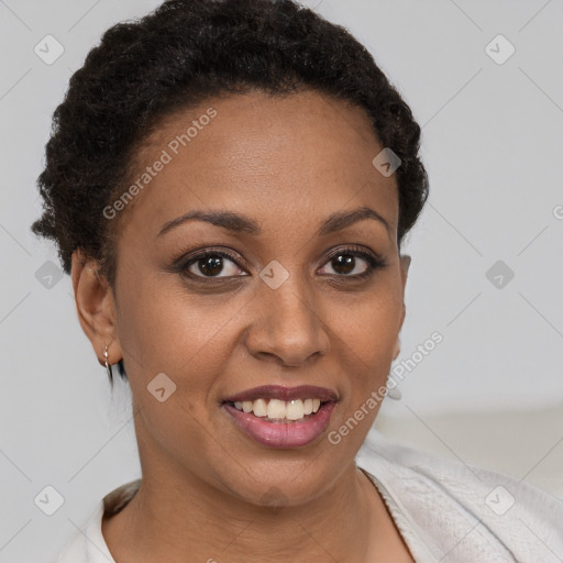 Joyful black young-adult female with short  brown hair and brown eyes