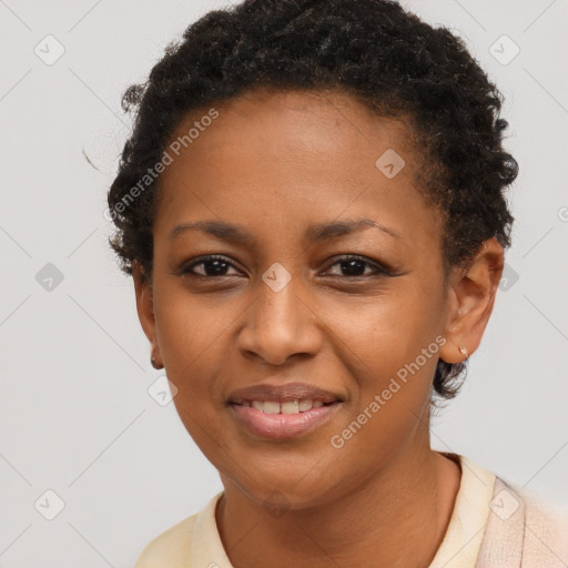Joyful black young-adult female with short  brown hair and brown eyes