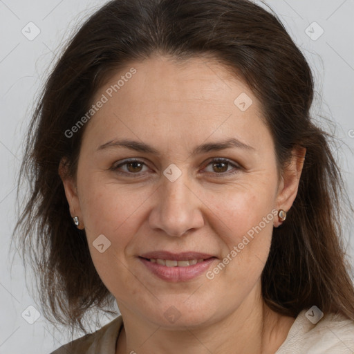 Joyful white adult female with medium  brown hair and brown eyes