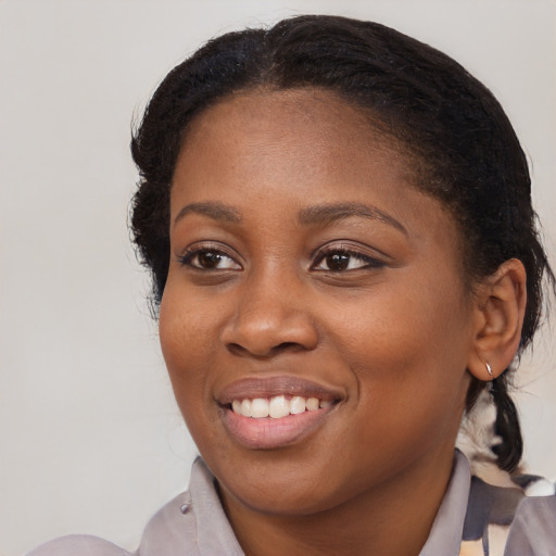 Joyful black young-adult female with medium  brown hair and brown eyes