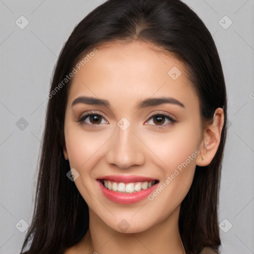 Joyful white young-adult female with long  brown hair and brown eyes