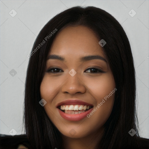 Joyful latino young-adult female with long  black hair and brown eyes