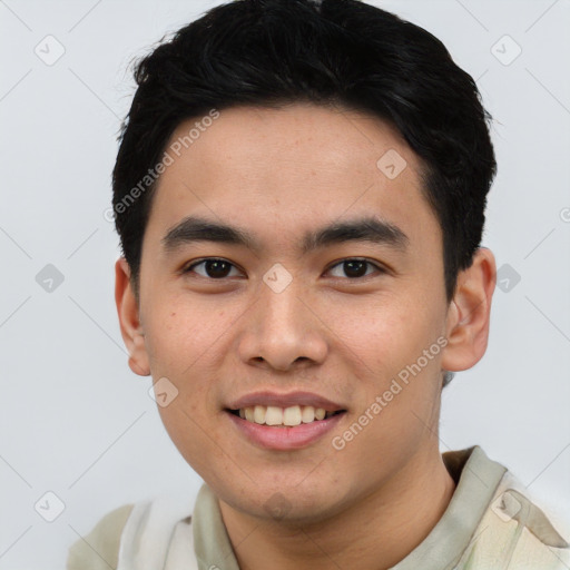 Joyful asian young-adult male with short  black hair and brown eyes