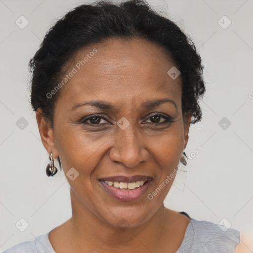 Joyful black adult female with short  brown hair and brown eyes